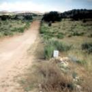 Photo of a graded dirt road going through countryside