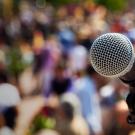 Microphone against backdrop of blurred crowd