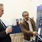 National Science Foundation Director Arden Bement, left, looks at the research work of UC Davis student Marcos Torres after Bement spoke March 5 about science and innovation.