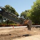 Backhoe works in the Old Davis Road median.