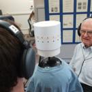 UC Davis graduate student Bob Dalton, left, tries out the sound studio as researcher Ralph Algazi, a co-developer of motion-tracked binaural sound, looks on.