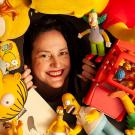 UC Davis Professor Karma Waltonen poses with Simpsons memorabilia