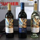 Three wine bottles (two red, one white) with colorful labels on a counter. UC Davis-labeled releases this year will include a Napa Valley 2022 cabernet sauvignon, a Napa Valley 2025 sauvignon blanc and a Yolo County 2025 albariño. (UC Davis)