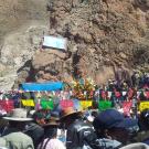 People gathering at rocky sanctuary site in Peru.