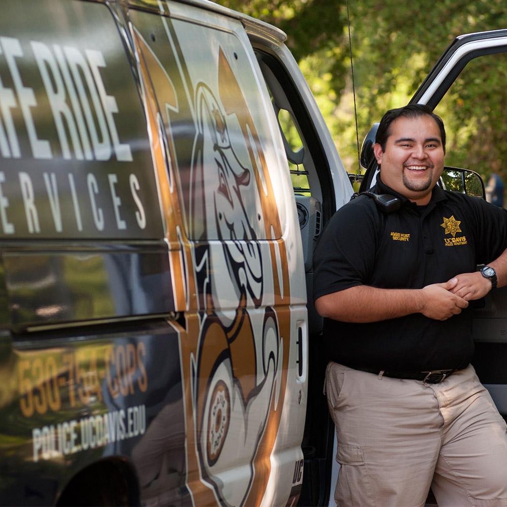 police officer standing next to the safe ride vehicle