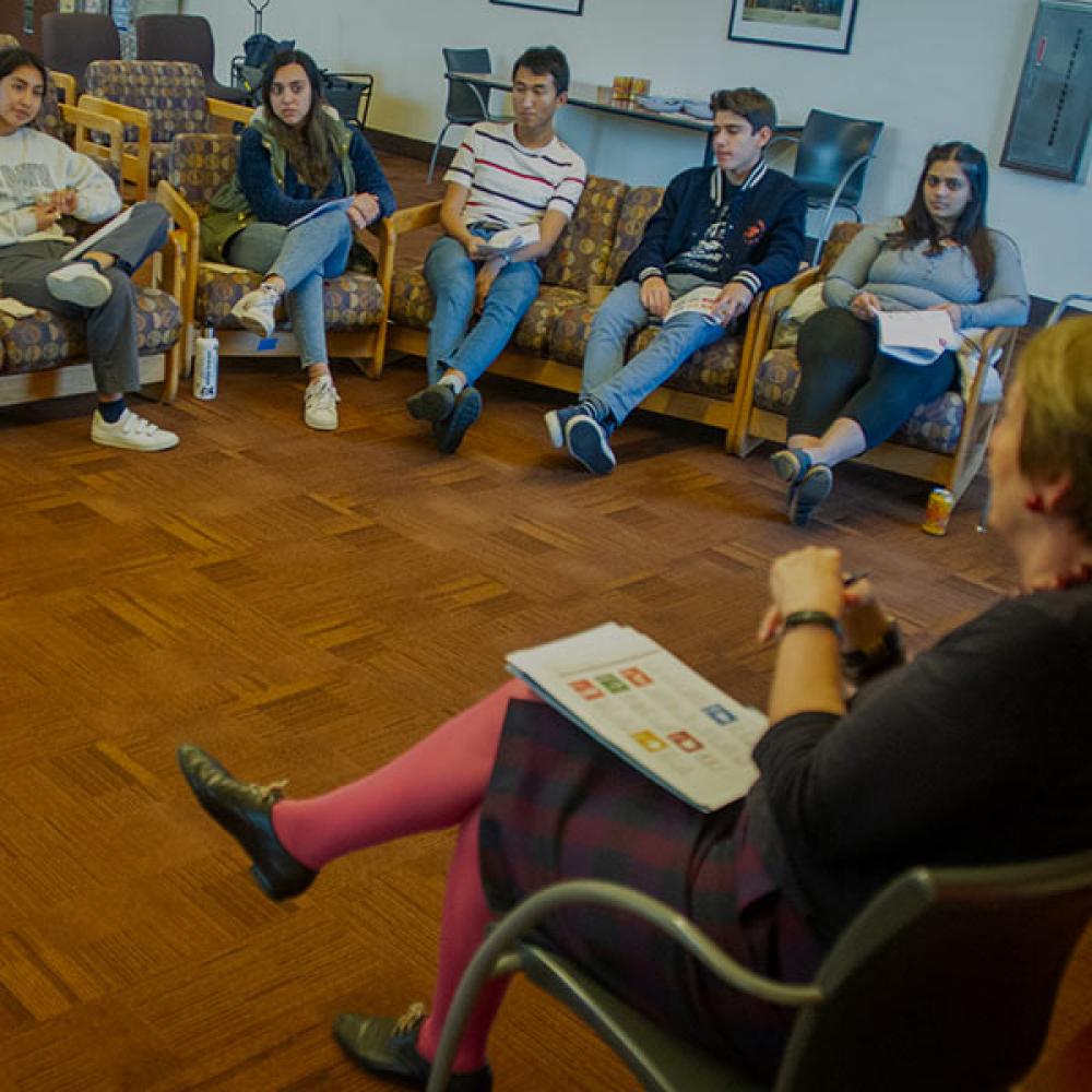 students listen to a professor