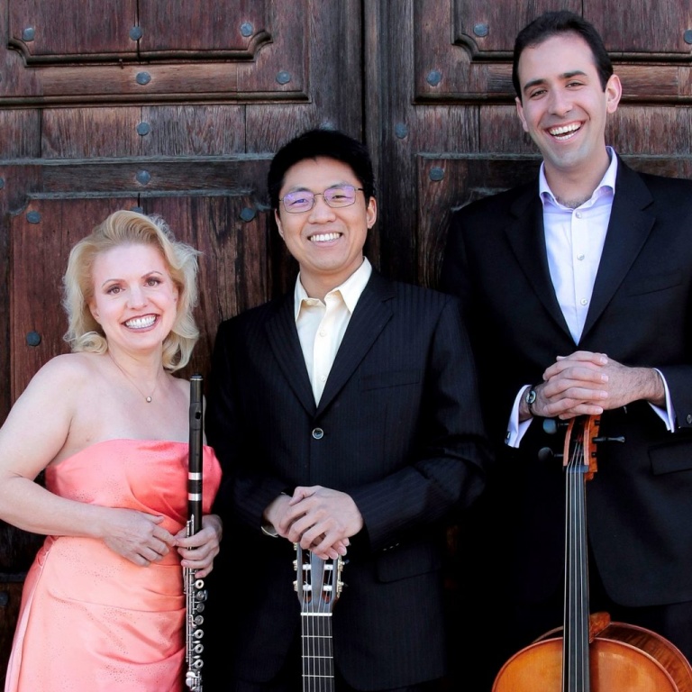 The members of the Black Cedar Trio holding their instruments.