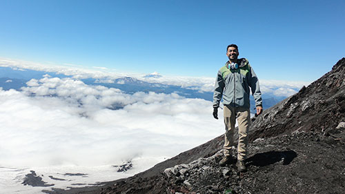 A man standing at a volcano